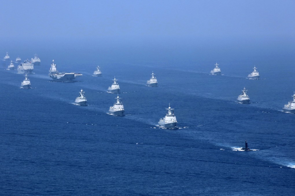 China’s Liaoning aircraft carrier is accompanied by navy frigates and submarines during military exercises in the South China Sea in 2018. Photo: AP