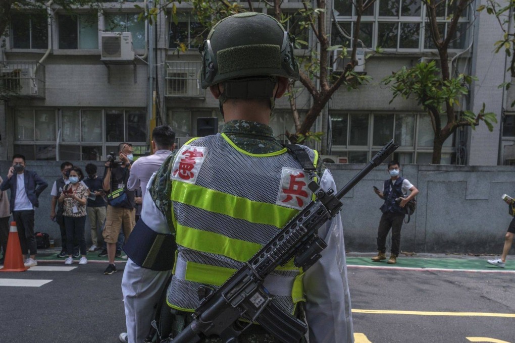 A military police office stands guard during an air raid drill in Taipei on Monday. Photo: Bloomberg