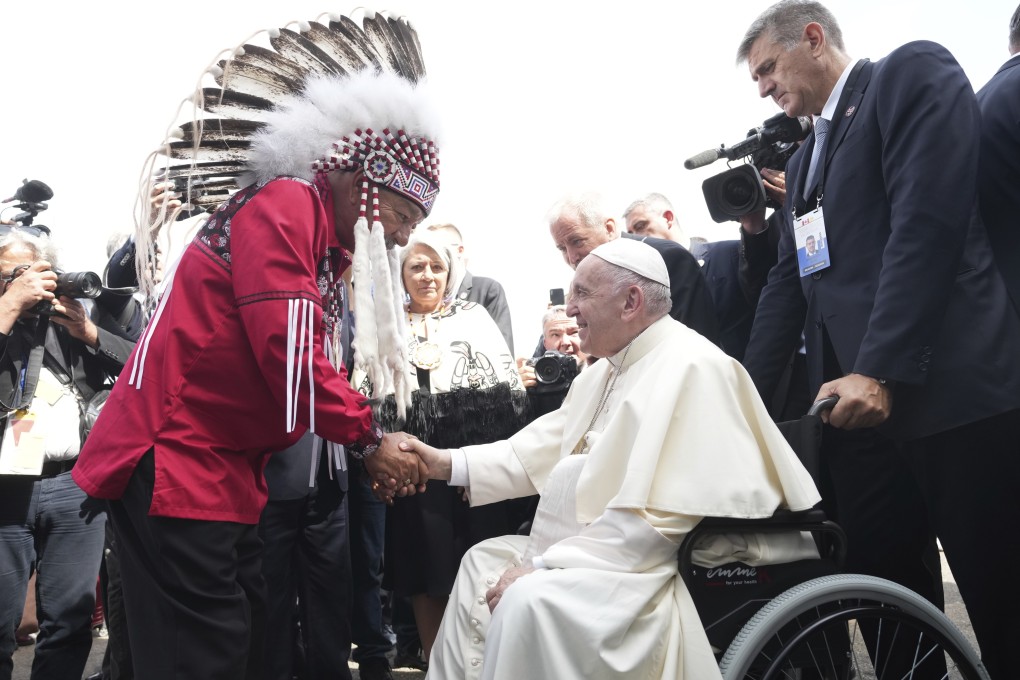Pope Francis is greeted by George Arcand, Grand Chief of the Confederacy of Treaty Six First Nations, as he arrives in Edmonton, Alberta, Canada on Sunday,. Photo: The Canadian Press via AP