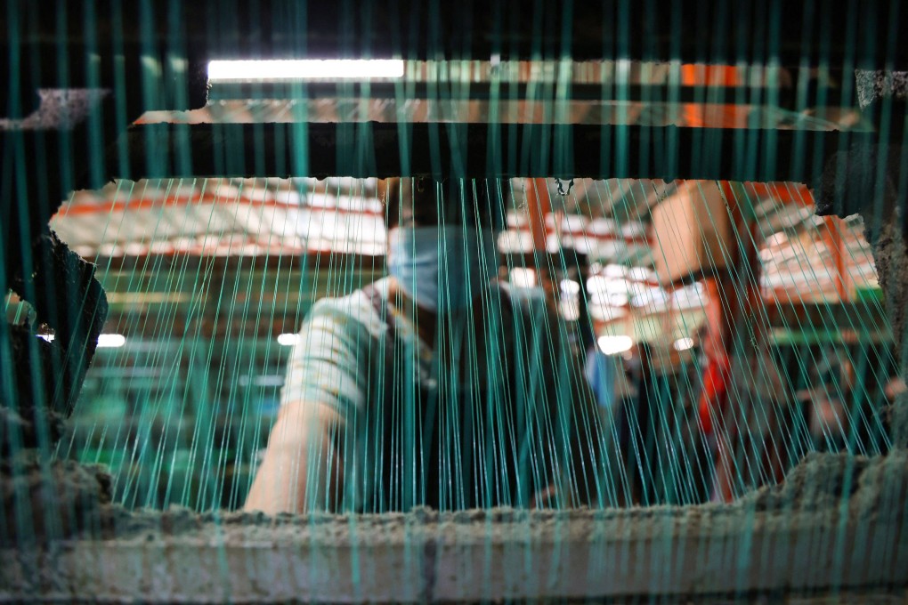 The IMF has slashed China’s economic growth forecast to 3.3 per cent, down from the 4.4 per cent forecast in April. Photo: AFP