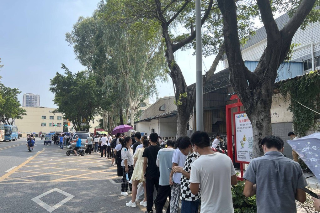 Job seekers lined up outside Foxconn’s recruitment centre in Longhua, Shenzhen for interviews and medical checkups. Photo: SCMP/Iris Deng