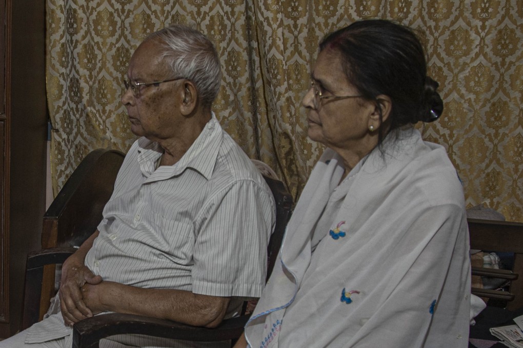 An elderly Indian couple watch TV together. Increasing numbers of older Indians are deciding to divorce after many years together. File photo: AP