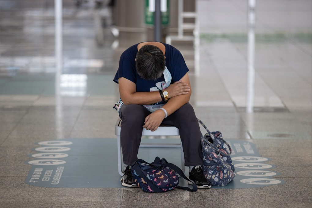 A traveller naps on a bench at the Hong Kong International Airport on July 12. EPA-EFE