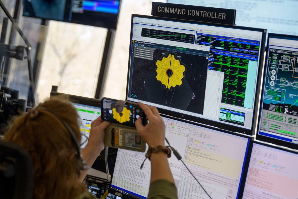 An engineer at Nasa’s James Webb space telescope mission operations centre at the Space Telescope Science Institute in Baltimore, Maryland, monitors progress as the observatory’s second primary mirror wing rotates into position on January 8.  Photo: Nasa/AFP