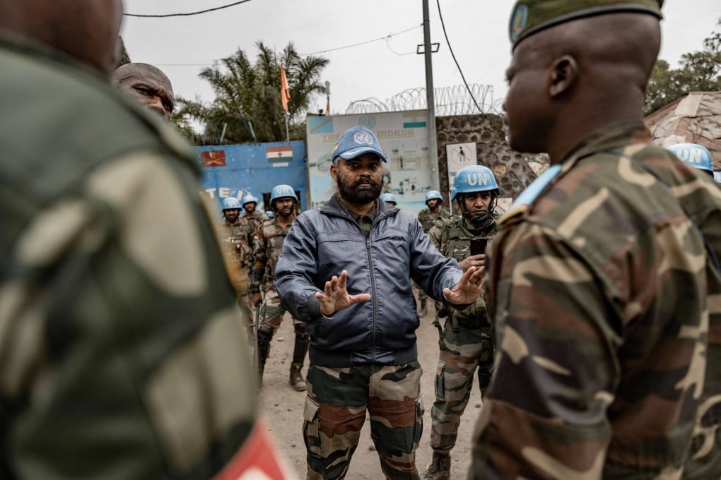 An Indian officer with the UN peacekeeping mission MONUSCO talks with Congolese Army officers in front of a UN base in Goma. Photo: AFP