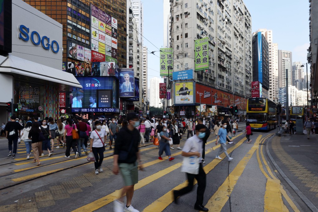Pedestrians in the shopping hub of Causeway Bay. Hong Kong’s growth has been stunted by tough Covid measures. Photo: Nora Tam