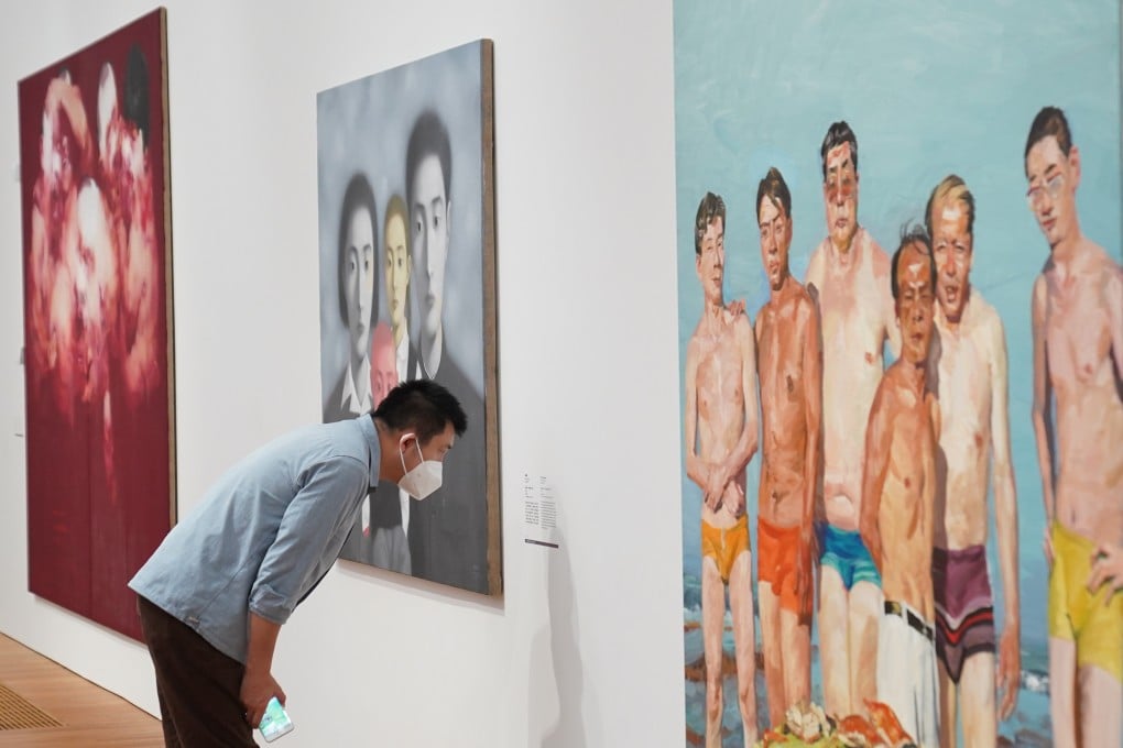 A visitor reads information about a painting at the M+ Museum in Hong Kong’s West Kowloon Cultural District. Photo: Sam Tsang