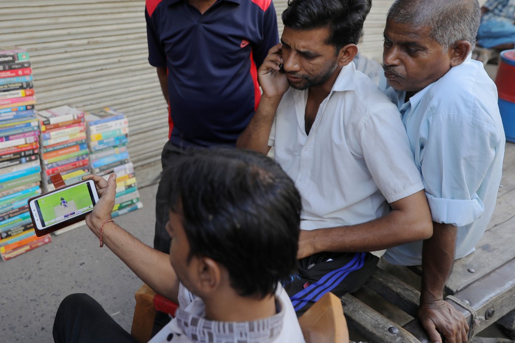 People watch a cricket match on a smartphone in New Delhi. File photo: Shutterstock