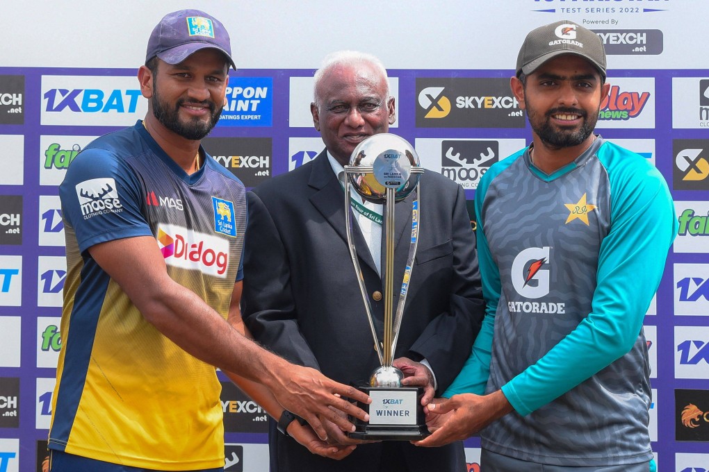 Sri Lanka’s captain Dimuth Karunaratne (left) and Pakistan’s captain Babar Azam pose with the Test trophy after Sri Lanka won the second Test at the Galle International Cricket Stadium. Photo: AFP