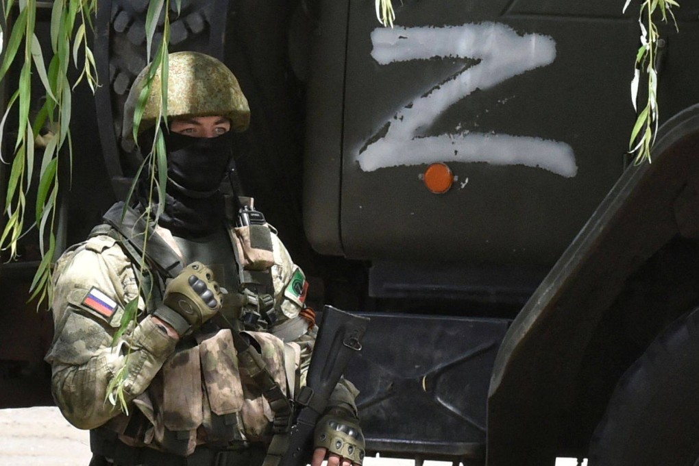 A Russian soldier guards a grain elevator in Melitopol, Zaporizhzhia region, Ukraine. The UK says Moscow has tasked mercenaries to hold sections of the front line. Photo: AFP
