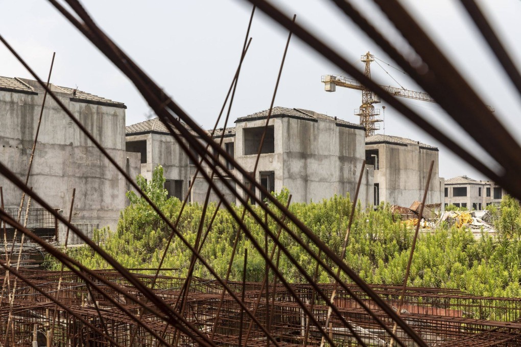 Residential buildings under construction at Tahoe Group’s Cathay Courtyard development in Shanghai. The recent spate of people not paying their mortgages in China threatens to drag sales down even further and damage banks and developers. Photo: Bloomberg