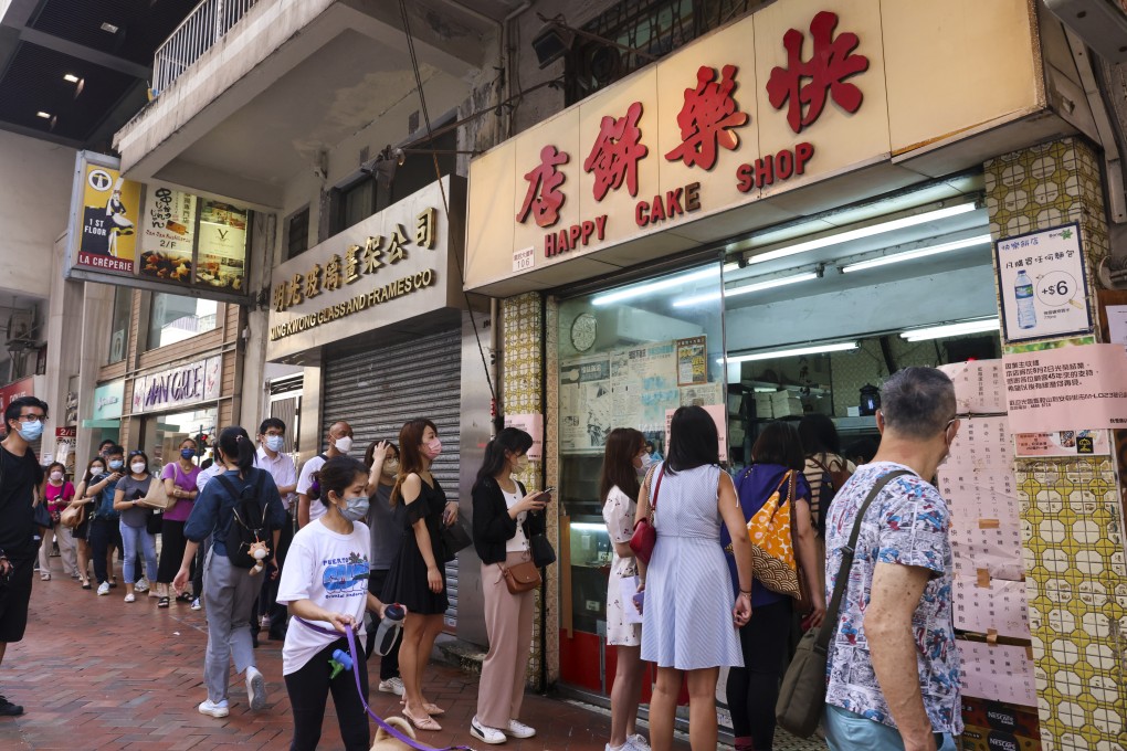 Customers queue up at Happy Cake Shop in Wan Chai after the popular bakery announced it would close on August 3. Bakeries like this are getting thin on the ground in Hong Kong. Photo: Dickson Lee