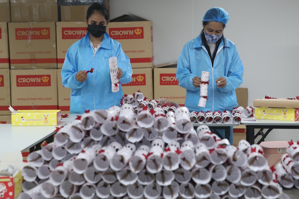 Workers from ethnic minority communities make Christmas crackers in Hong Kong’s Kowloon Bay on December 10, 2021, as part of a charity project. Photo: Edmond So