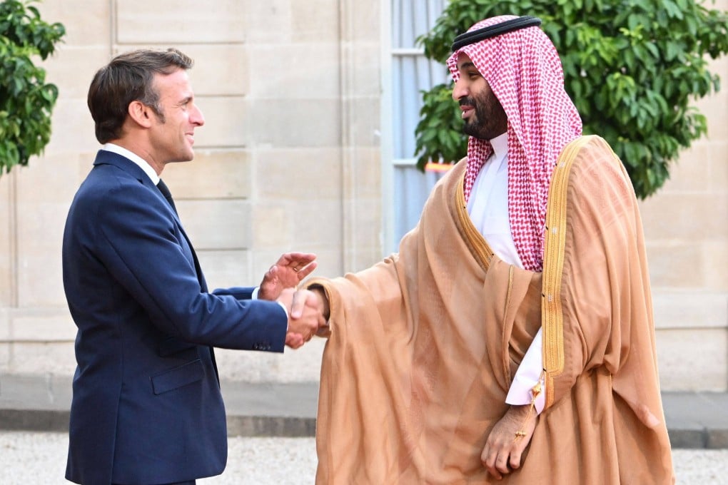 France’s President Emmanuel Macron greets Saudi Crown Prince Mohammed bin Salman at the Elysee Palace in Paris on Thursday. Photo: AFP