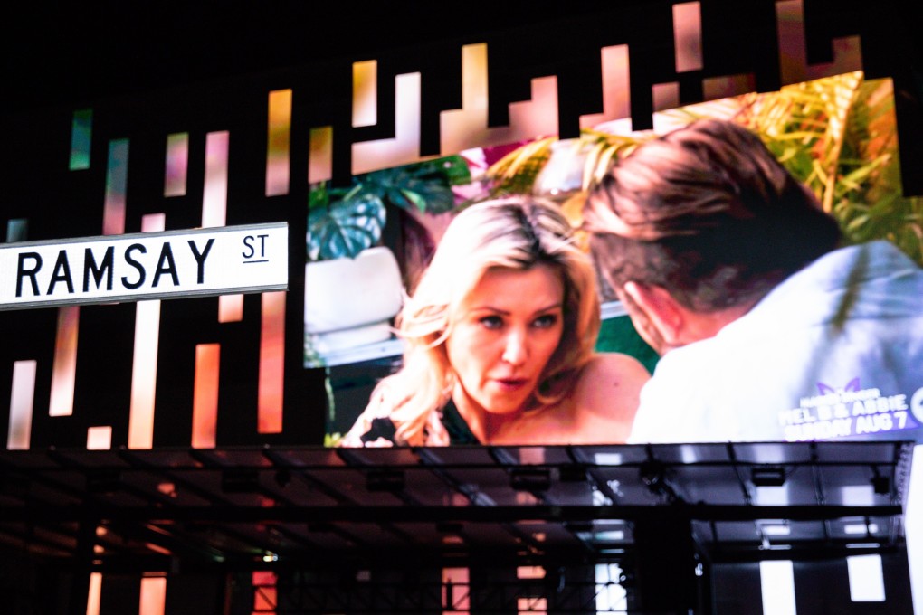 People watch a screening of the finale of TV show Neighbours in Melbourne, Australia on Thursday. Australia’s longest-running TV soap opera signed off after 37 years on Thursday. Photo: EPA-EFE
