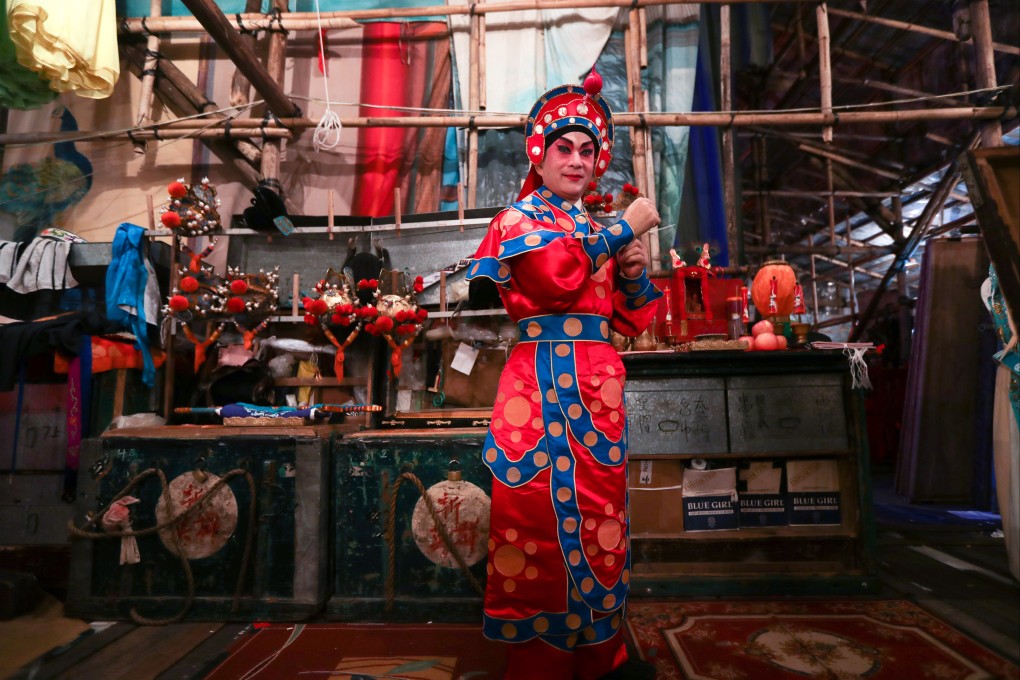 An artist prepares for a Chinese opera performance backstage in a temporary bamboo theatre during a Taoist festival in Shek O on November 10, 2016. Both traditional opera and the building of bamboo theatres are listed in Hong Kong’s Intangible Cultural Heritage Database. Photo: Nora Tam