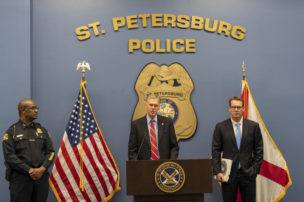 US lawyer Roger B Handberg, centre, alongside St Petersburg Police Chief Anthony Holloway, left, and FBI Special Agent David Walker, at St Petersburg Police Department headquarters in Florida, US on Friday. Photo: Tampa Bay Times via AP