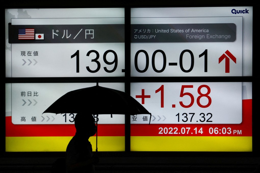 A man passes a monitor showing the exchange rate of the Japanese yen against the US dollar in Tokyo on July 14. Photo: Reuters