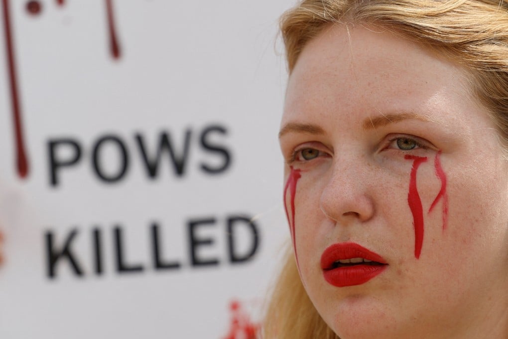 Yuliana, girlfriend of a defender of the Azovstal Iron and Steel Works in Mariupol, attends a rally demanding to recognise Russia as a state sponsor of terrorism after killing Ukrainian prisoners of war (POWs) in a prison in Olenivka, outside of Donetsk, as Russia’s attack on Ukraine continues, in Kyiv, Ukraine July 30, 2022. Photo: Reuters