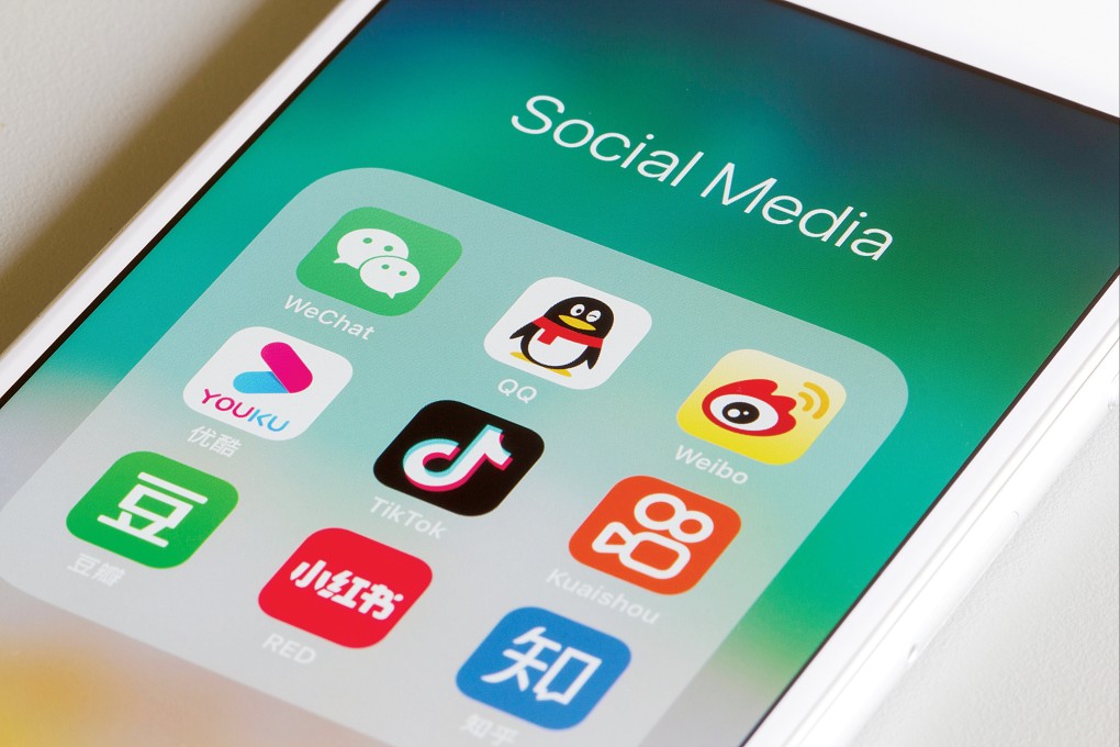 Assorted Chinese social media apps are seen on an iPhone, including WeChat, QQ, Weibo, Youku, TikTok, Kuaishou, Douban, Xiaohongshu and Zhihu. Photo: Shutterstock