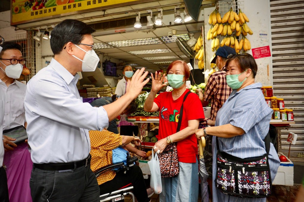Chief Executive John Lee Ka-chiu during a community visit to Sham Shui Po. Photo: Facebook