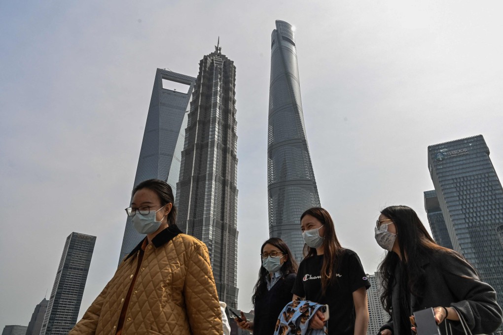 Pedestrian in the financial district of Shanghai. Photo: AFP
