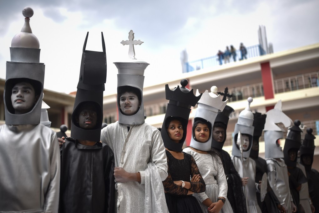 Students dress up as chess pieces to celebrate the Olympiad taking place in Chennai. Photo: EPA-EFE