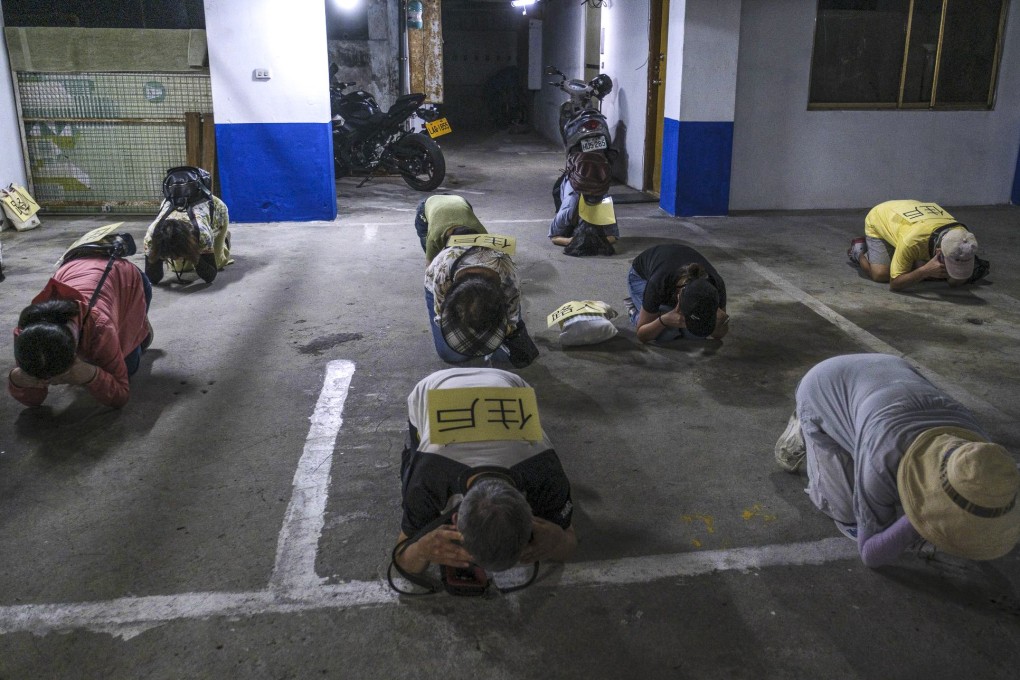 Residents take cover in an underground shelter during an air-raid drill in Taipei on July 25. Photo: Bloomberg