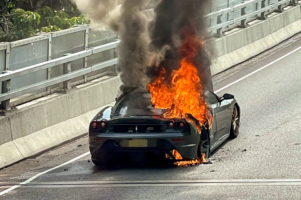 A Ferrari sports car is seen going up in flames at the Sha Tin-bound Shing Mun Tunnel Road near Mei Chung Court at about 2.30pm. Photo: Facebook