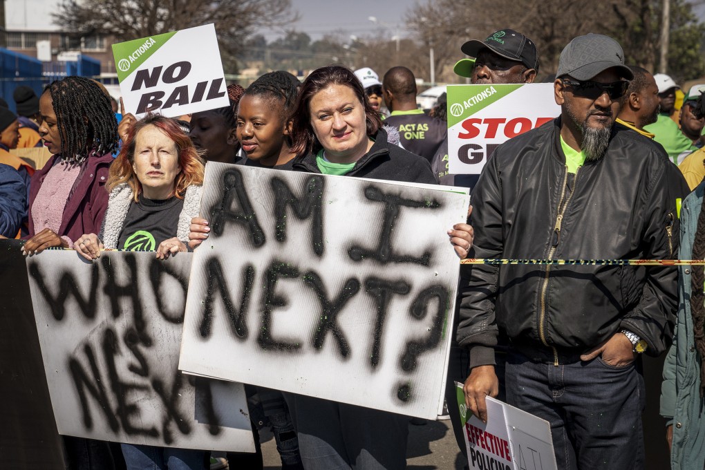 Women protest outside the Krugersdorp, South Africa after more than 80 men suspected of gang rapes appeared in court on Monday. Photo: AP