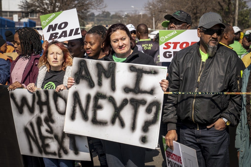 Women protest outside the Krugersdorp, South Africa after more than 80 men suspected of gang rapes appeared in court on Monday. Photo: AP