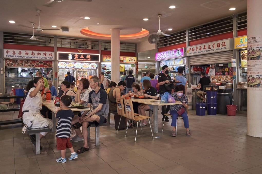 People have breakfast at Tiong Bahru Market hawker centre in Singapore last month. Photo: Bloomberg