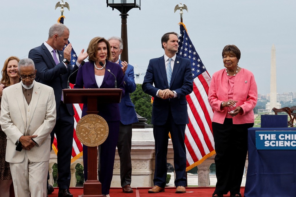 US House Speaker Nancy Pelosi is flanked by members of Congress during a bill enrollment ceremony for the “Creating Helpful Incentives to Produce Semiconductors (CHIPS) and Science Act of 2022”, legislation that subsidizes the US domestic semiconductor industry, on July 29. Photo: Reuters
