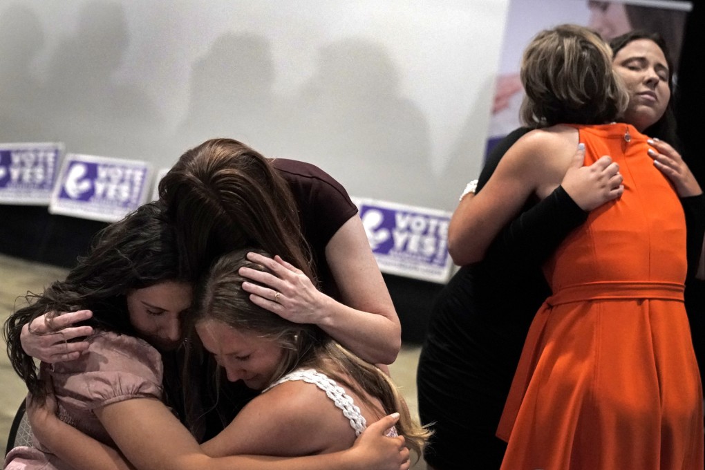 People hug during a Value Them Both watch party after a question involving a constitutional amendment removing abortion protections from the Kansas constitution failed. Photo: AP