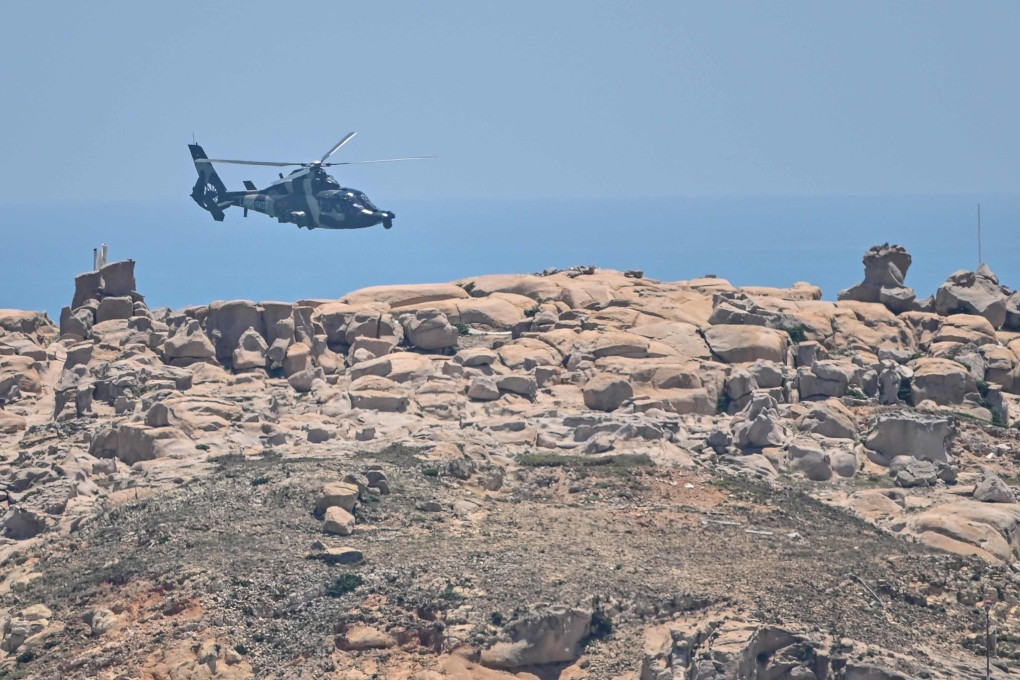 A Chinese military helicopter flies past Pingtan island, one of mainland China’s closest point from Taiwan, on August 4, 2022. Photo: AFP