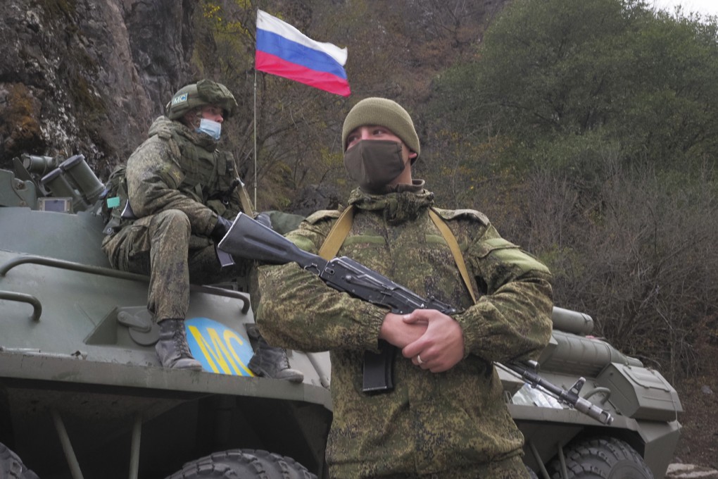 Russian peacekeepers patrol as ethnic Armenians leave the separatist region of Nagorno-Karabakh in November 2020. Despite the presence of 2,000 such personnel, the truce with Azerbaijan has remained fragile. Photo: AP