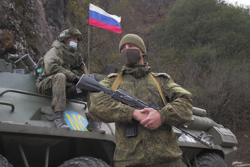 Russian peacekeepers patrol as ethnic Armenians leave the separatist region of Nagorno-Karabakh in November 2020. Despite the presence of 2,000 such personnel, the truce with Azerbaijan has remained fragile. Photo: AP