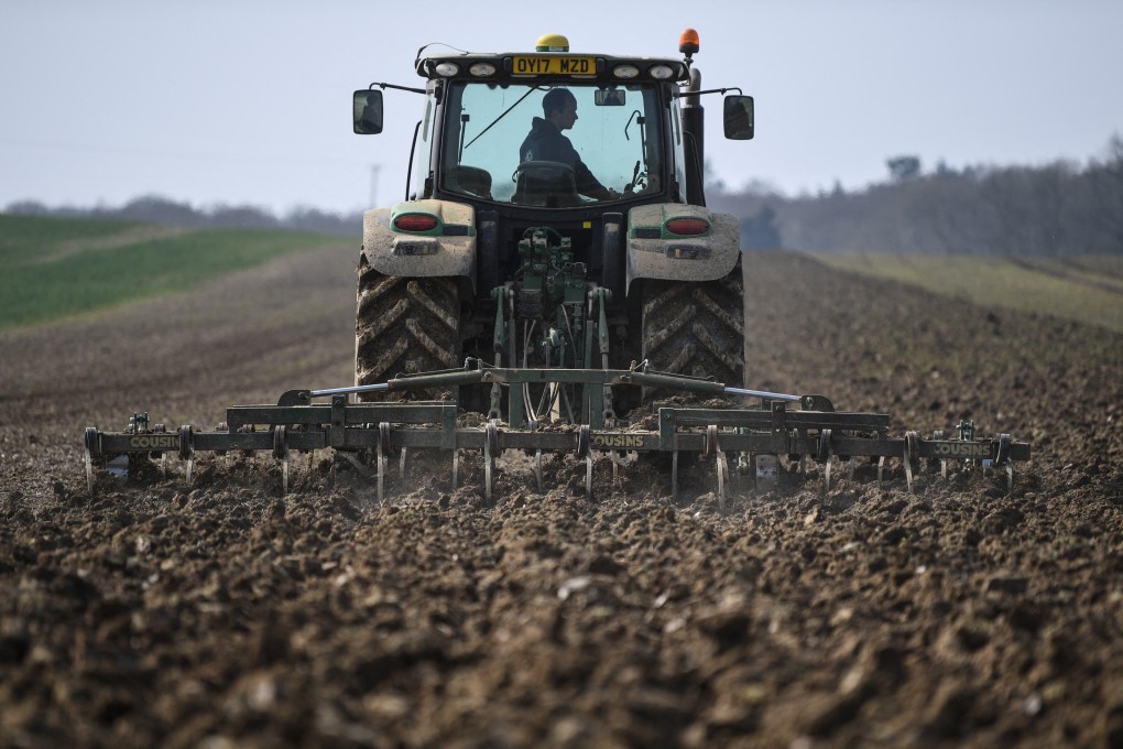 A tractor prepares farmland in England for sowing crops. Environmental activist George Monbiot says our current, large-scale, tillage farms – fuelled by fertiliser overkill – are killing soil fertility and aren’t the solution to feeding the world’s growing population. Photo: AFP