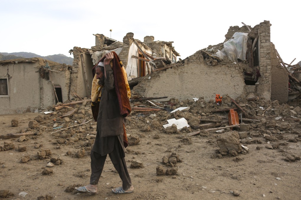 A man walks past houses damaged in an earthquake in Afghanistan’s Paktika province on June 23. Photo: Xinhua