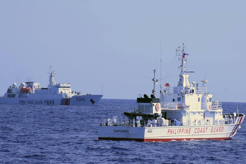 A Chinese coast guard ship shadows a Philippine coast guard vessel while conducting a maritime patrol in Scarborough Shoal in the South China sea. Photo: PCG / AFP