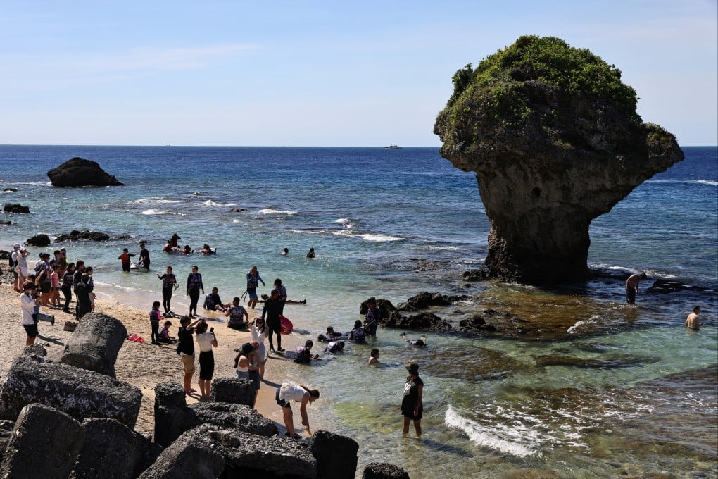 Tourists and snorkelers visit a beach on Liuqiu island, a tourist spot in Taiwan known for its sea turtles. Photo: Reuters