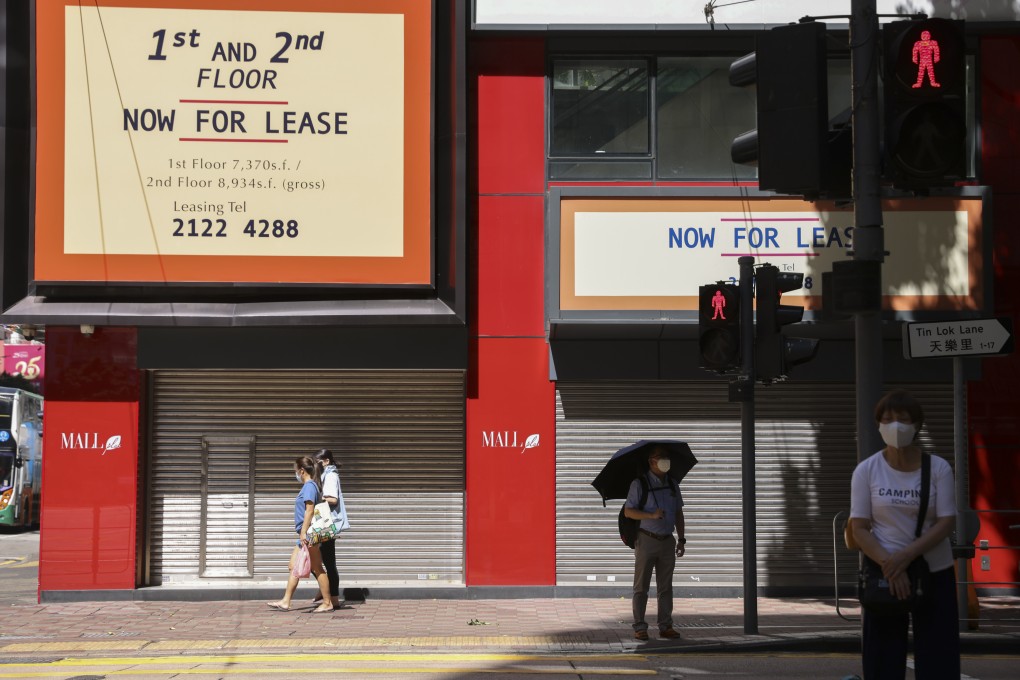 Pedestrians pass retail locations for rent in Hong Kong’s Causeway Bay district. Photo: SCMP / Nora Tam