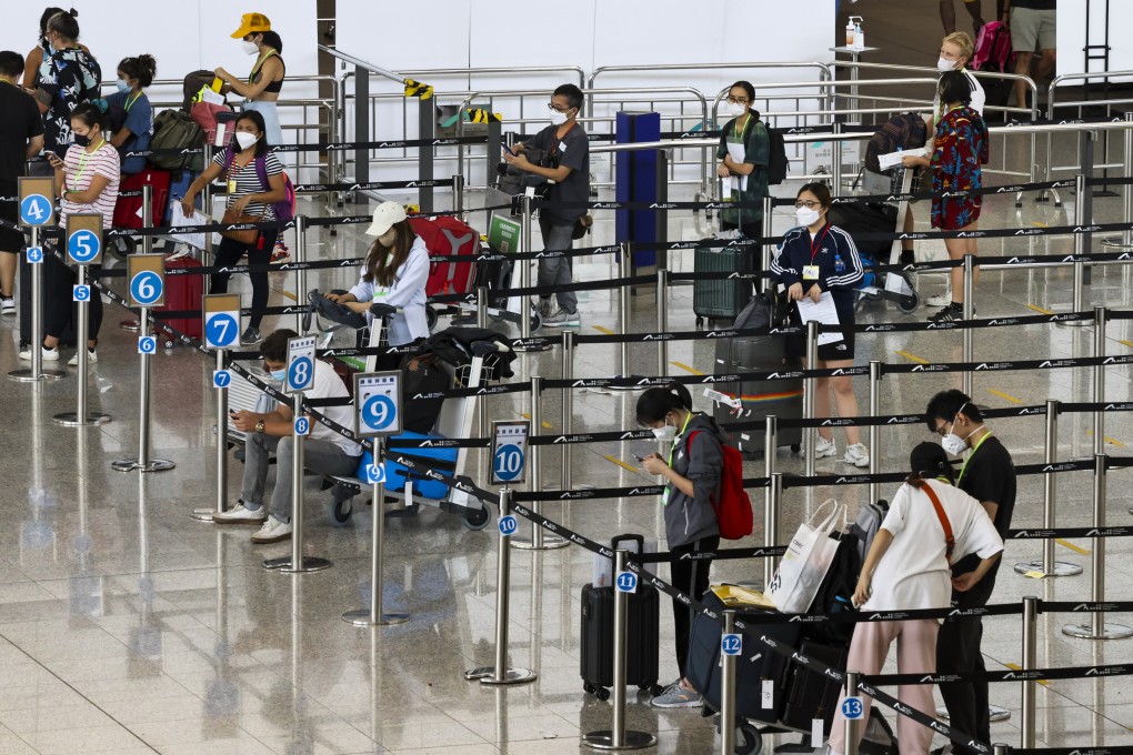 Arrivals at Hong Kong’s airport wait to be taken to their quarantine hotels. Photo: K. Y. Cheng