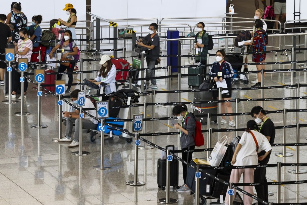 Arrivals at Hong Kong’s airport wait to be taken to their quarantine hotels. Photo: K. Y. Cheng