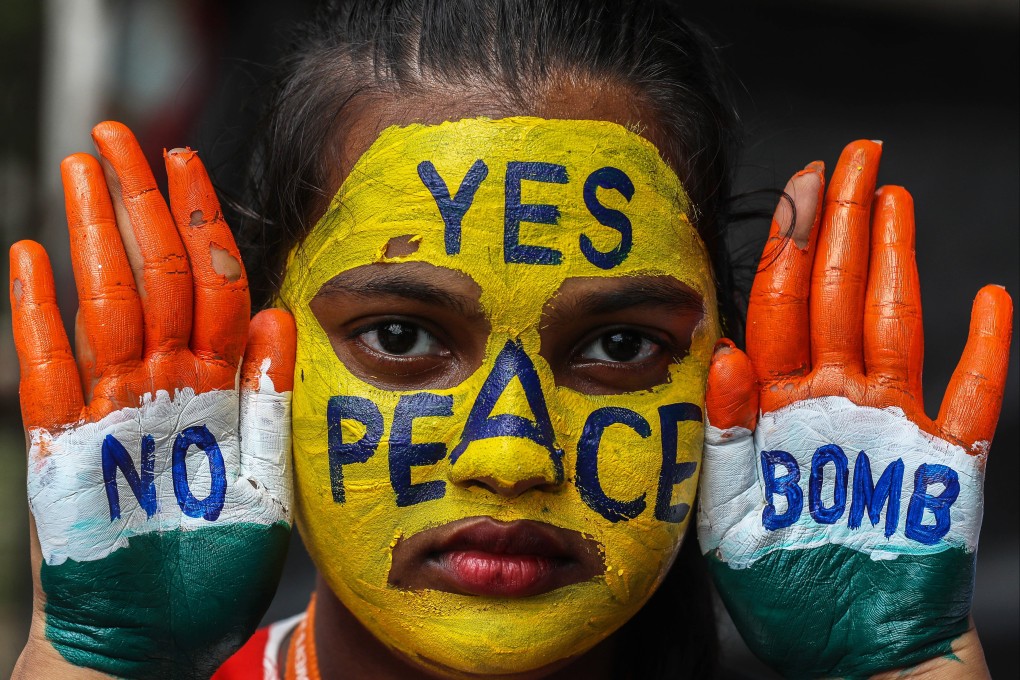 A student takes part in a peace rally in India. Photo: EPA-EFE