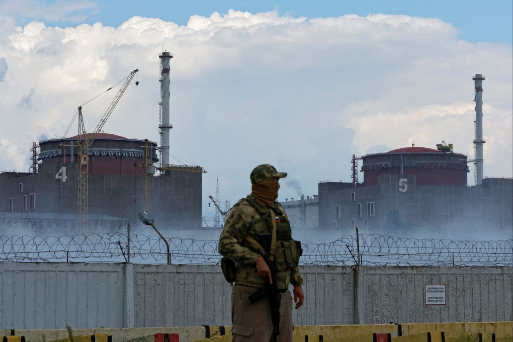 A serviceman with a Russian flag on his uniform stands guard near the Zaporizhzhia nuclear power plant outside the Russian-controlled city of Enerhodar in Ukraine on August 4. Photo: Reuters