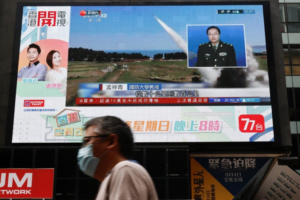A report on China’s People’s Liberation Army’s military exercises near Taiwan is displayed on a screen in Hong Kong on Friday. Photo: Reuters