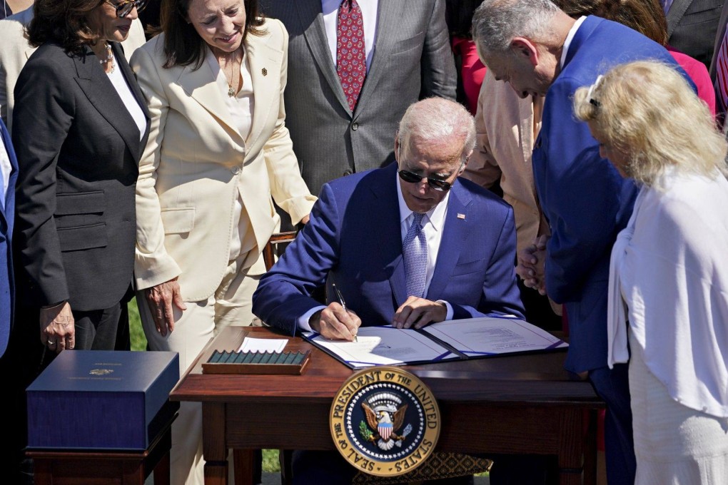 US President Joe Biden signing the Chips and Science Act of 2022 during a ceremony on the South Lawn of the White House on Tuesday. Photo: Bloomberg