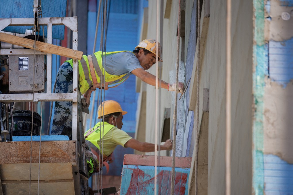 Men work at an apartment construction site just outside Beijing.
Photo: Reuters