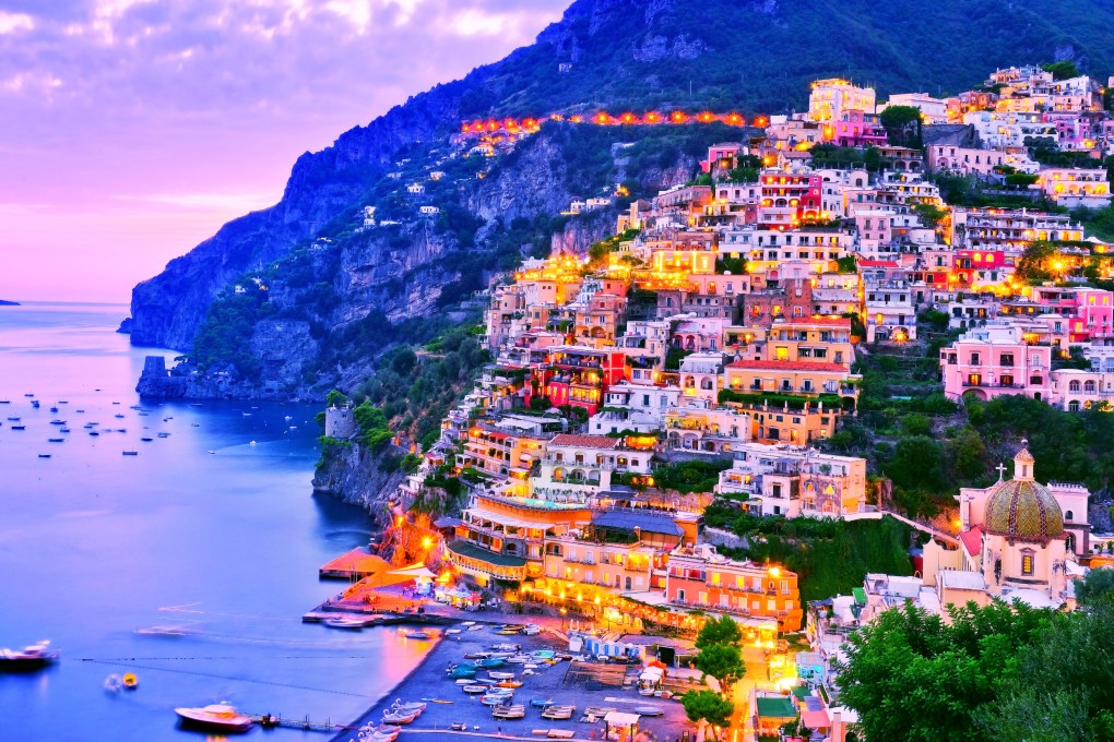 A view of Positano on the Amalfi Coast in Italy at dusk. A visit offers spectacular views, but it’s a tourist hotspot than can get very crowded. Photo: Shutterstock